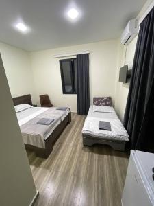Ένα ή περισσότερα κρεβάτια σε δωμάτιο στο Hotel Estonia Two