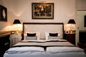 Postel nebo postele na pokoji v ubytování Hotel Belle Epoque