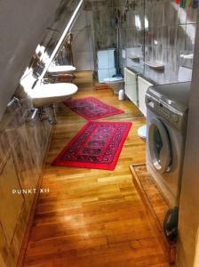 a bathroom with two sinks and a washing machine at Wohnung 3 in Burghaslach