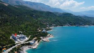 an aerial view of a resort on the shore of a lake at Sunny Hill Residence in Vlorë