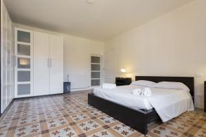 Ένα ή περισσότερα κρεβάτια σε δωμάτιο στο InnPisaRentals 2- Casa dei Cavalieri