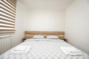Postel nebo postele na pokoji v ubytování Zanes Apartment