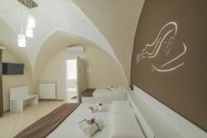 TV a/nebo společenská místnost v ubytování Le Suite del Dormiglione + 29 fotografií