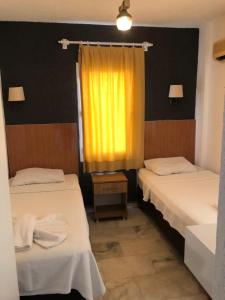 Postel nebo postele na pokoji v ubytování Kılavuz otel