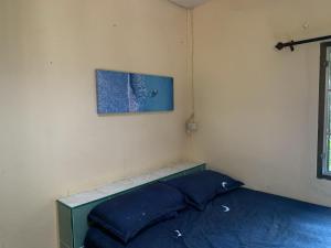 Postel nebo postele na pokoji v ubytování วังตาน้ำรีสอร์ท