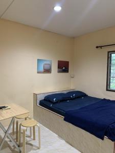 Postel nebo postele na pokoji v ubytování วังตาน้ำรีสอร์ท