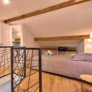 a bedroom with a large bed and a loft at Duplex 6 Pers - Panoramic Sea View - Old City - 2 mn Beach in Menton