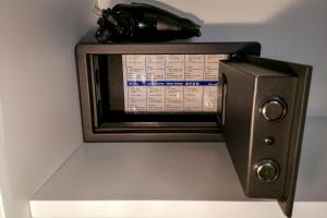 a microwave oven sitting on top of a shelf at Aparthotel AMMI Vieux Nice in Nice