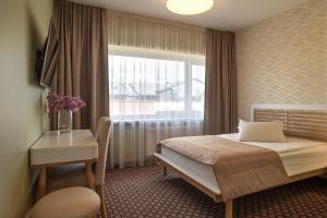 Postel nebo postele na pokoji v ubytování Hotel Sinchronas