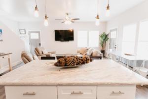 a kitchen with a pineapple in a bowl on a kitchen island at 230 9th Avenue in Ouray