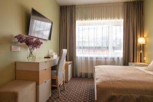 Postel nebo postele na pokoji v ubytování Hotel Sinchronas