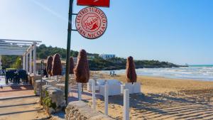 a sign for a restaurant on the beach at Centro Turistico San Nicola in Peschici