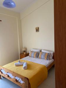 a bedroom with two beds with towels on them at Villa Christina ,Kalogria beach in Metóchion