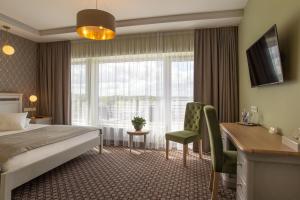 Postel nebo postele na pokoji v ubytování Hotel Sinchronas