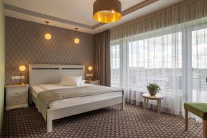 Postel nebo postele na pokoji v ubytování Hotel Sinchronas