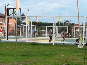 a group of people playing a game of volley ball at Eurich Furnished Unit 2 in Butuan