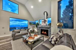 a living room with a couch and a fireplace at LUXE 4 Blue Diamond Lake Tahoe Lodge in Stateline