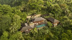 an aerial view of a house in the jungle at COMO Shambhala Estate in Payangan