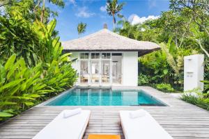 a house with a pool and a balcony at COMO Uma Ubud - CHSE Certified in Ubud