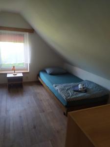 Postel nebo postele na pokoji v ubytování Prázdninový domek v Českém ráji