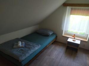 Postel nebo postele na pokoji v ubytování Prázdninový domek v Českém ráji