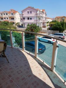 a balcony with a view of a parking lot at myVodice in Vodice