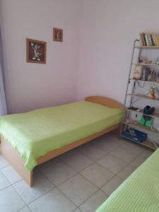 A bed or beds in a room at Derveni Summer House Még 19 kép