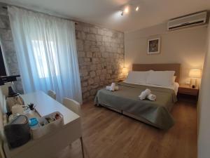 Postel nebo postele na pokoji v ubytování Carol Rooms