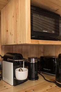 a kitchen counter with a toaster oven and a microwave at Yurt with Hot Tub near Hartington, Peak District in Buxton
