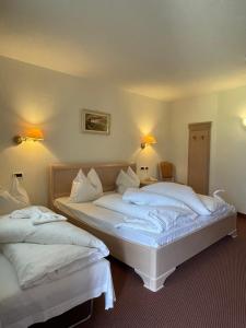Voodi või voodid majutusasutuse Hotel Larch toas