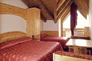 Posteľ alebo postele v izbe v ubytovaní Hotel Almazzago