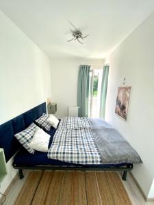 Posteľ alebo postele v izbe v ubytovaní Apartman 001