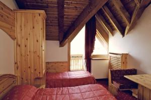 Posteľ alebo postele v izbe v ubytovaní Hotel Almazzago