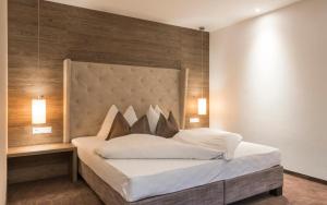 Postel nebo postele na pokoji v ubytování Hotel Rosengarten