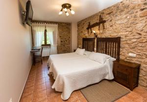 Casa Castiñeira tesisinde bir odada yatak veya yataklar