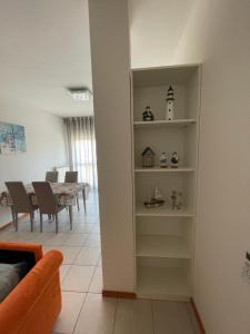 a living room with a table and a dining room at Appartamento Mare in Cavallino-Treporti