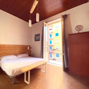 A bed or beds in a room at Marilù