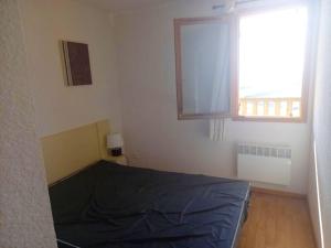 Posteľ alebo postele v izbe v ubytovaní Appartement confortable à Besse - 40 m² avec balcon vue montagne