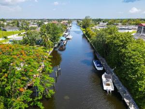a river with boats parked on the sides of it at Waterfront Pool Villa with Sailboat access in Cape Coral