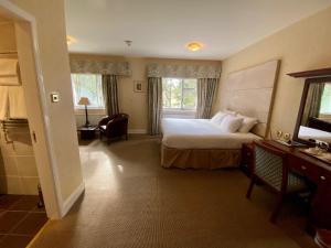 Postel nebo postele na pokoji v ubytování Ramnee Hotel