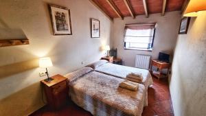 Postel nebo postele na pokoji v ubytování Casa Tinoco Casa Rural Categoria Superior