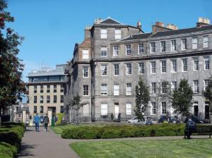 a large building with people walking in front of it at Georgian 2 Bedroom Apartment in Edinburgh