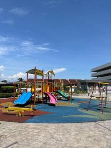 a playground with colorful slides and slidesktop at Ipoh Manhattan TSL Pool View Water Park Homestay! in Kampong Pinji
