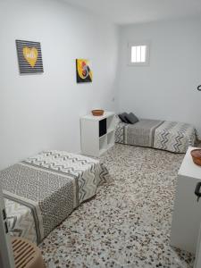 Postel nebo postele na pokoji v ubytování Casa Maria