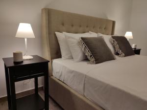 Ένα ή περισσότερα κρεβάτια σε δωμάτιο στο VagiaNa apartment Διαμέρισμα κοντά στο αεροδρόμιο