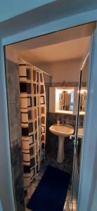a bathroom with a sink and a toilet and a mirror at Casa Jax in Rîmeţi +55 photos