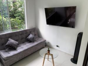TV a/nebo společenská místnost v ubytování Mango Home + 6 fotografií
