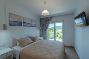 Olive Garden Villas and Apartments客房内的一张或多张床位