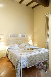 En eller flere senger på et rom på Agriturismo Petrognano