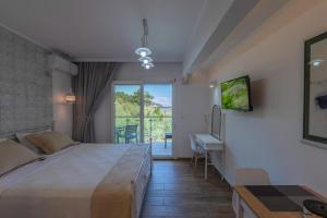 Posteľ alebo postele v izbe v ubytovaní Olive Garden Villas and Apartments
